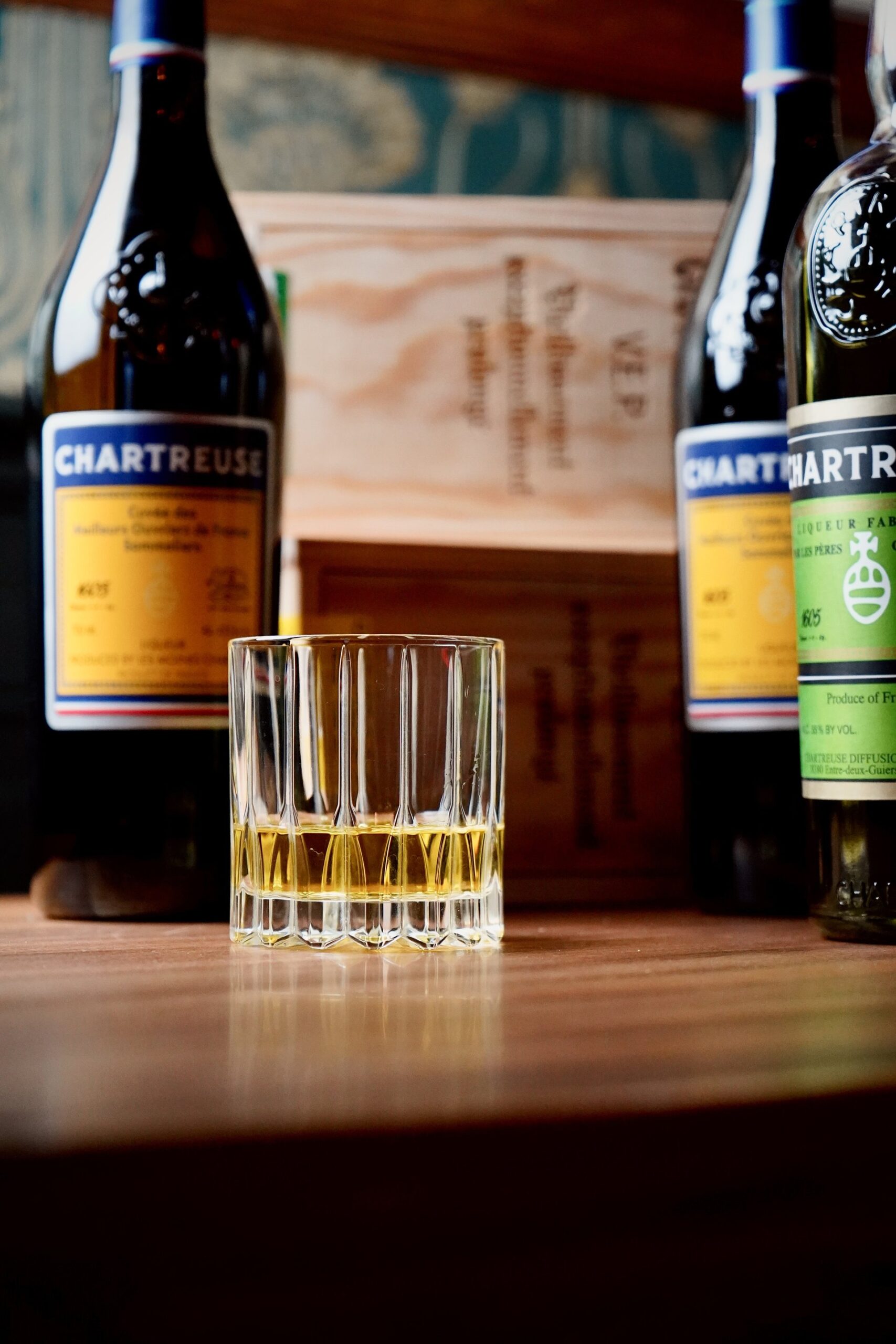 Whisky and Chartreuse on the bar